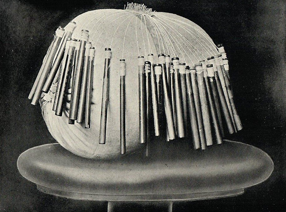 Lace bobbins on pillow, an example of Belgian lace